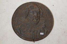 An antique cast iron wall plaque with portrait of William Shakespeare in raised relief, 21" diameter