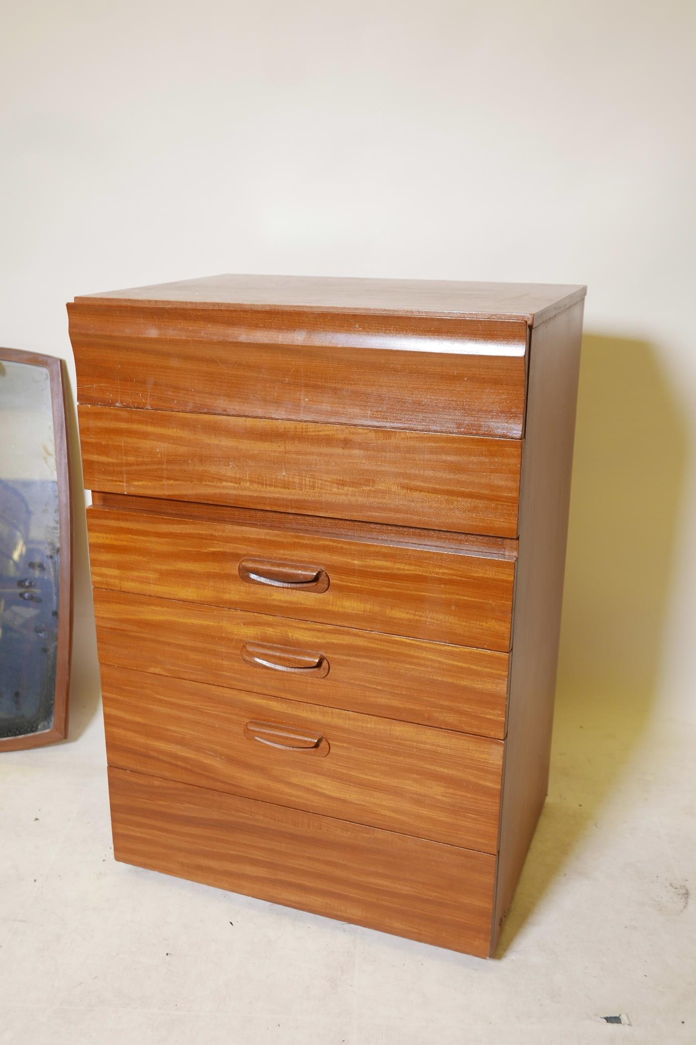 A 1970s teak chest of six drawers, labelled to the reverse, together with a mid century teak mirror, - Image 2 of 4