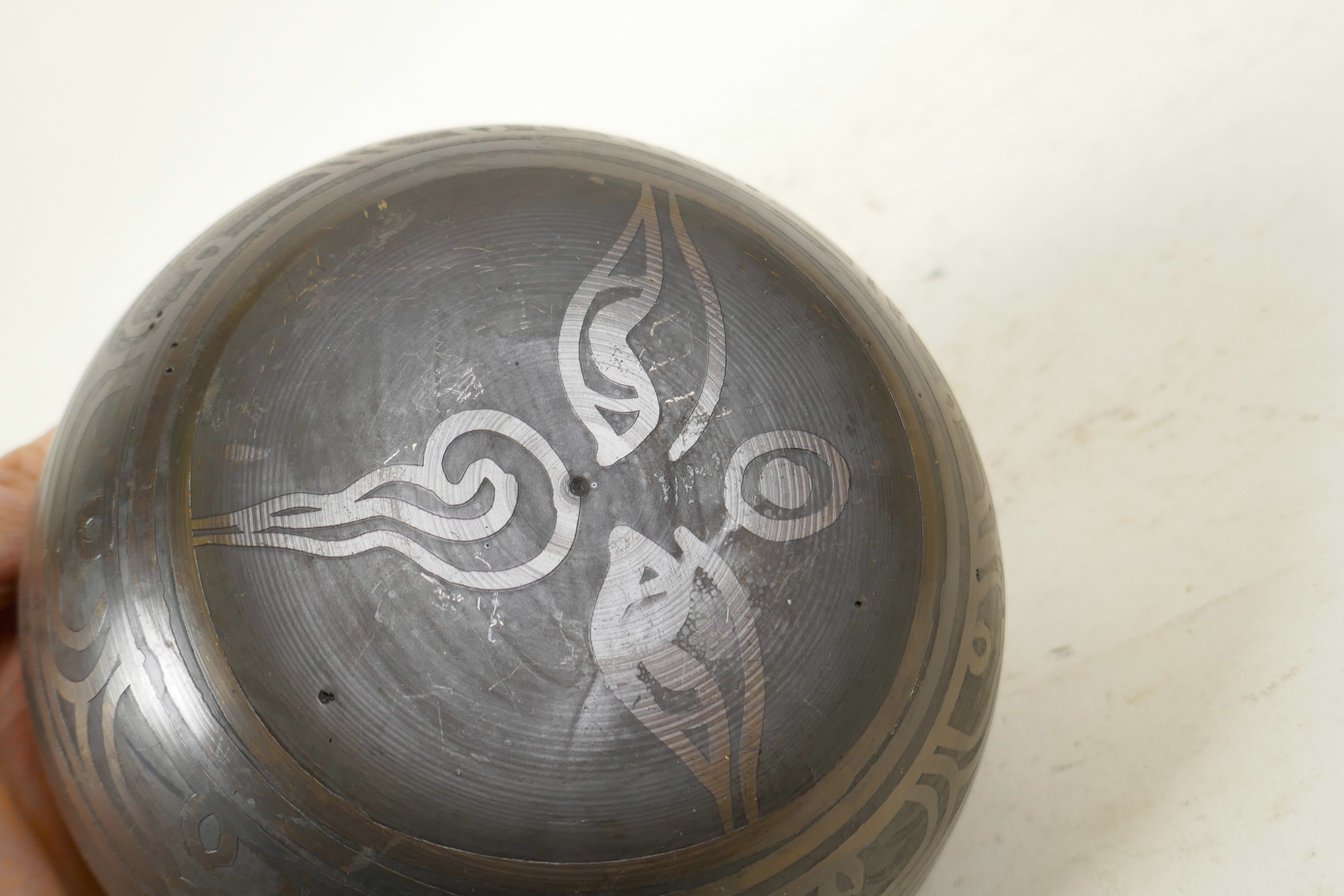 A Tibetan gilt bronze singing bowl, and another with character script decoration to exterior and - Image 6 of 7