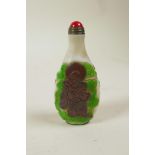 A Chinese Peking glass style snuff bottle decorated with two Immortals, 3" high