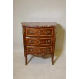 A French faded rosewood bowfront and shaped sided commode of three drawers, with finely inlaid