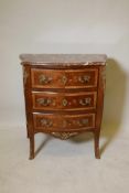 A French faded rosewood bowfront and shaped sided commode of three drawers, with finely inlaid