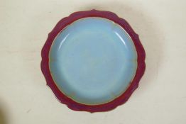 A Chinese Jun ware dish of lobed form, raised on tripod feet, 10"