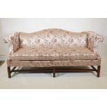 A vintage camel back settee on fluted square walnut supports upholstered in floral silk fabric,