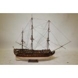 A scratch built wooden model of a three masted 62 gun warship complete with brass cannon, hull to