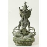 An elaborate Sino-Tibetan bronze figure of a four faced Buddha seated on a lotus throne, 9" high