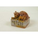 A Chinese soapstone seal with carved kylin knop and character inscription to side, 2½" x 2½"
