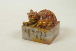 A Chinese soapstone seal with carved kylin knop and character inscription to side, 2½" x 2½"
