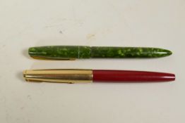 A Parker VP fountain pen with a 14ct nib, and a green cased Swan Blackbird fountain pen with a