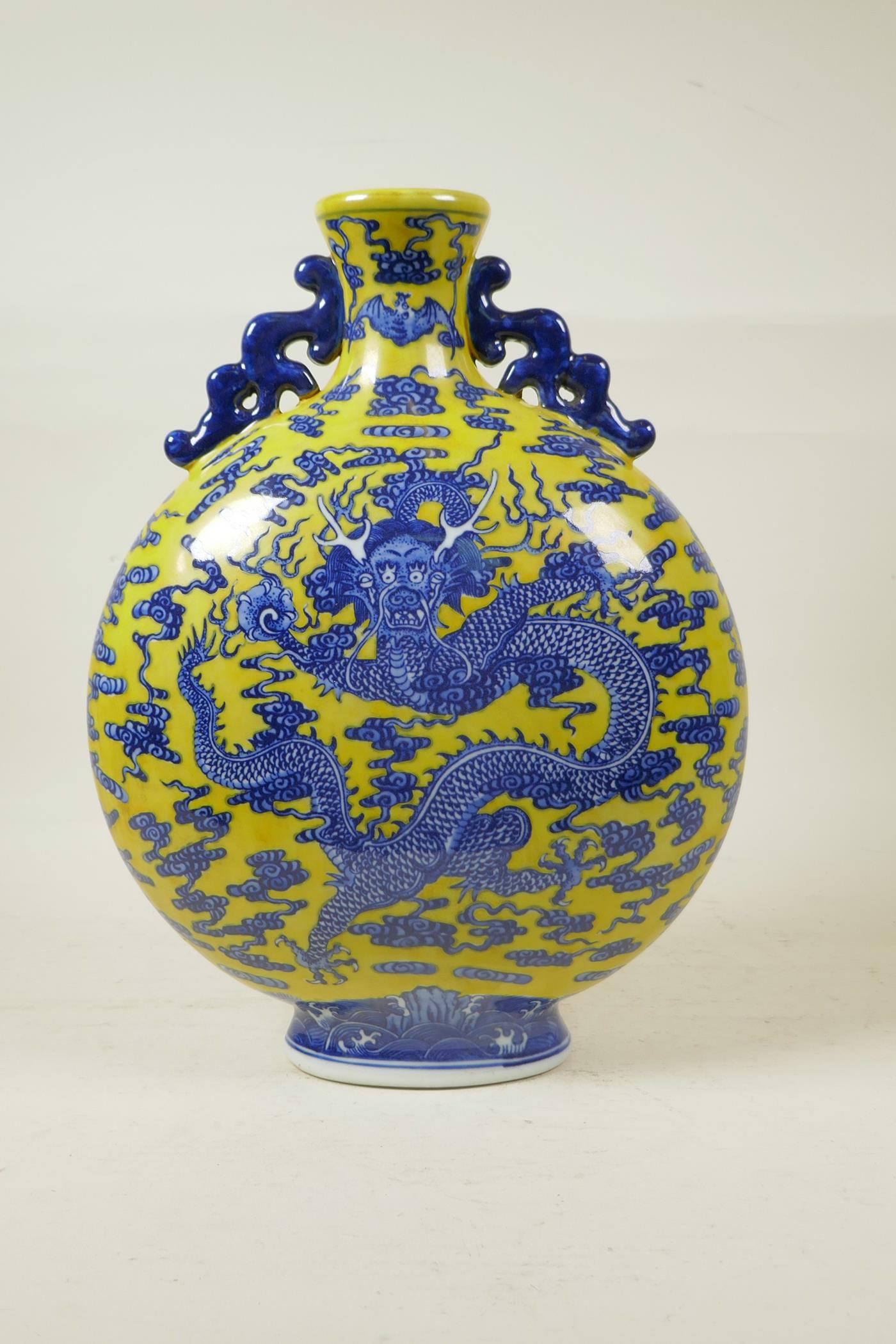 A Chinese yellow ground porcelain two handled moon flask with blue and white dragon decoration, seal - Image 3 of 4