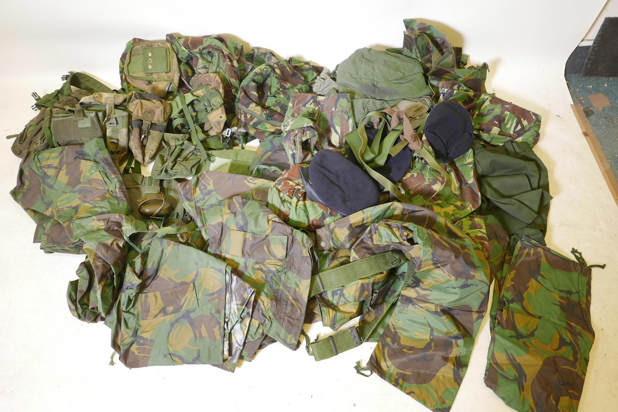 A large quantity of British Army uniforms and equipment including waterproofs, three boxes