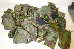 A large quantity of British Army uniforms and equipment including waterproofs, three boxes