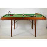 A Pegasus half size snooker table, balls and cues, 72" x 36"