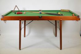 A Pegasus half size snooker table, balls and cues, 72" x 36"