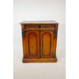 A C19th mahogany cupboard with single frieze drawer over two doors and painted decoration, 31" x 18"
