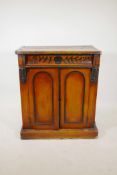 A C19th mahogany cupboard with single frieze drawer over two doors and painted decoration, 31" x 18"