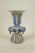 A Chinese blue and white porcelain gu shaped vase with two loop handles, 7" high, A/F chips to rim