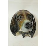 An Art Deco Beswick ware ceramic wall plaque modelled as the head of a spaniel, hand painted with