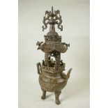 A Chinese bronze censer with elaborate pagoda shaped open work lid, 17" high