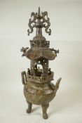 A Chinese bronze censer with elaborate pagoda shaped open work lid, 17" high