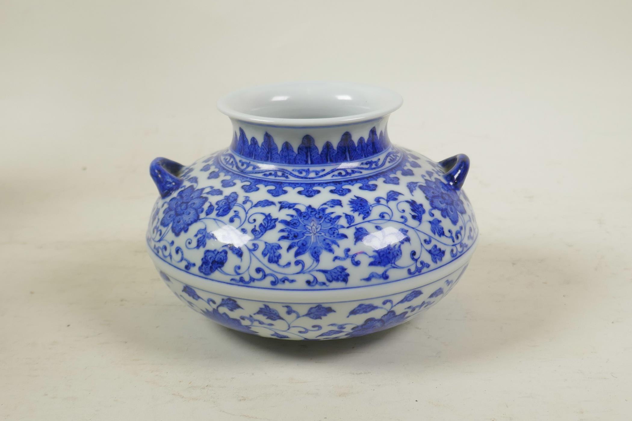 A Chinese blue and white porcelain squat form vase with two handles and scrolling lotus flower - Image 3 of 4