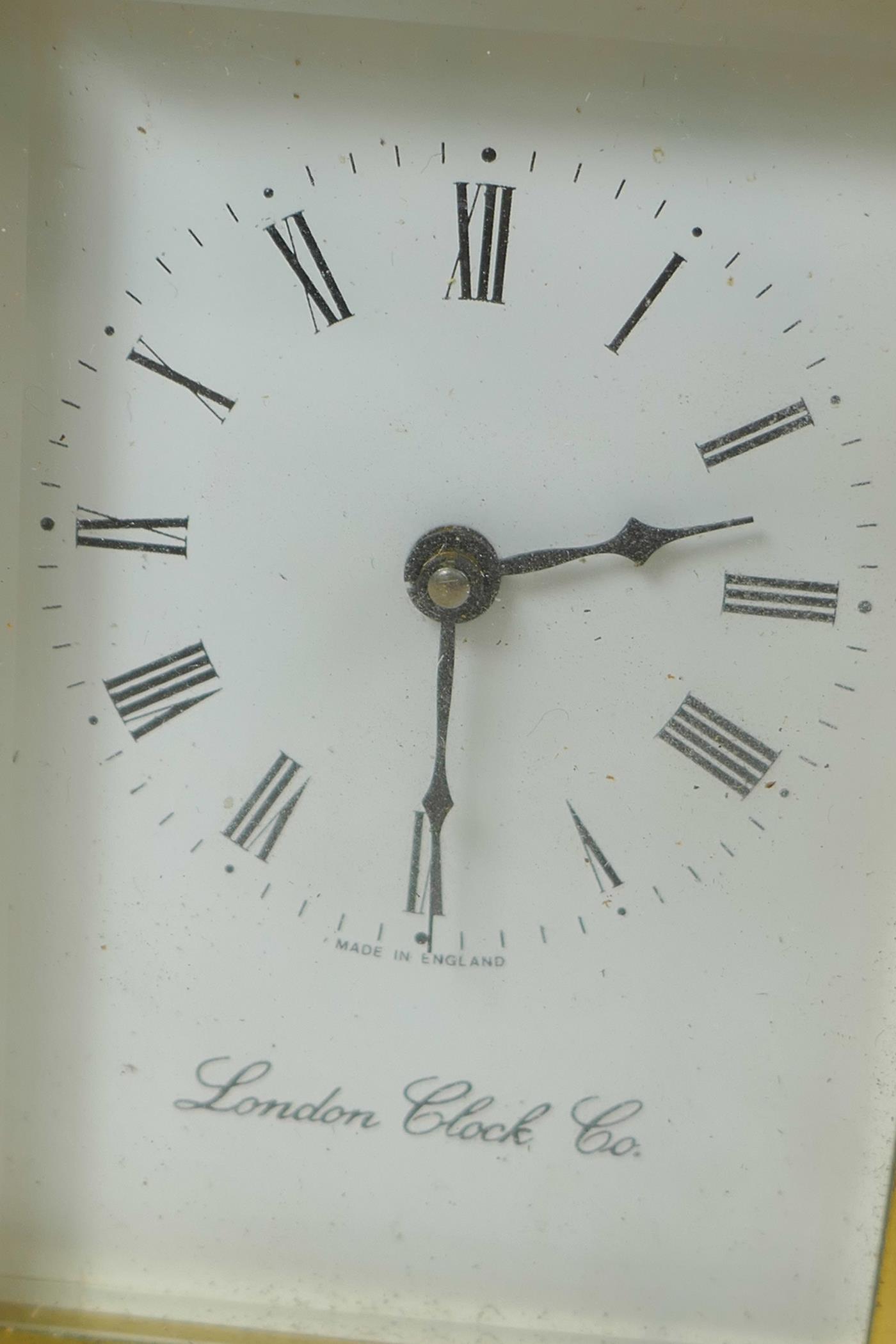 A brass cased carriage clock from the London Clock Company with white enamel dial and Roman - Image 2 of 4