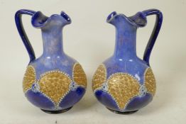 A pair of Royal Doulton stoneware candlesticks in the Art Nouveau style, impressed HA, 6" high