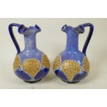 A pair of Royal Doulton stoneware candlesticks in the Art Nouveau style, impressed HA, 6" high