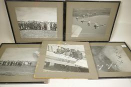 Two photographs of seven radial engined biplanes flying in tight formation and three others of the
