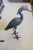 A patinated metal garden figure of a heron, 34½" high