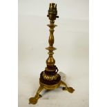 An Art Nouveau brass table lamp with compound brass column and three spade feet, 13" high