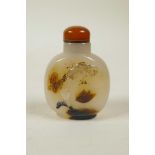 A Chinese agate snuff bottle with carved butterfly, bird and lotus flower decoration, 2½" high