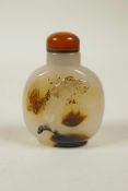 A Chinese agate snuff bottle with carved butterfly, bird and lotus flower decoration, 2½" high