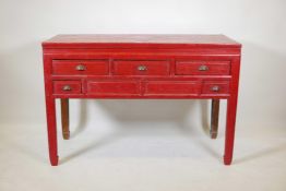 A Chinese red lacquered hardwood, five drawer desk/side table, 51" x 21", 34" high