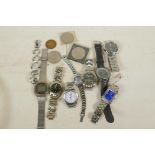 A collection of wristwatches, coins etc