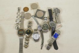 A collection of wristwatches, coins etc
