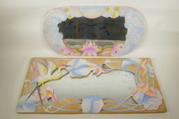 A Chinese carved and painted wood mirror decorated with lotus flowers, and another similar,