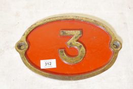 A brass and enamel engine plate, no.3, 11" x 7"