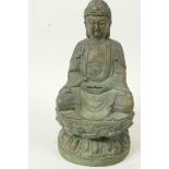 A Chinese bronze figure of Buddha seated in meditation on a lotus throne, having green patination,