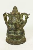 A bronze figure of Ganesh seated on a lotus throne, 5½" high