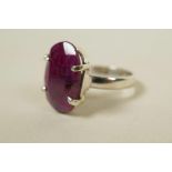 A sterling silver gemstone ring, inset with an 11ct natural red ruby, oval cut, hallmarked, 9g total