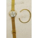 A Christian Lacroix gilt watch and bracelet, boxed