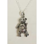 A 925 silver teddy bear pendant necklace with articulated limbs