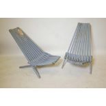 A pair of Scandinavian painted and slatted teak folding outdoor chairs
