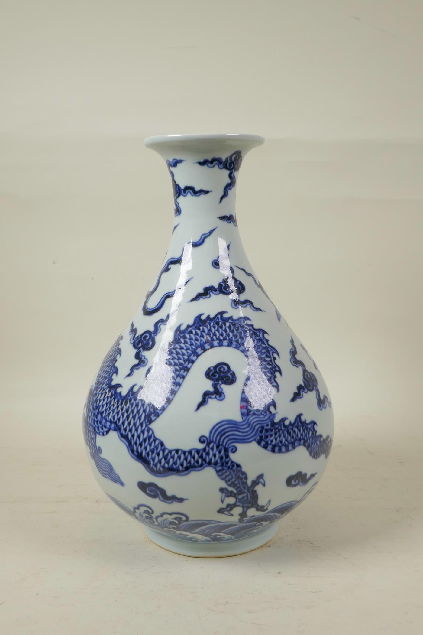 A Chinese blue and white porcelain pear shaped vase decorated with a dragon in flight, 12" high - Image 3 of 4