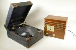 A Decca salon travel gramophone in a canvas and metal strapped case, a collection of 78s and a retro