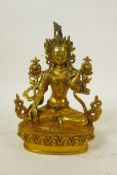 A Sino-Tibetan gilt bronze of a female deity seated on a lotus throne, double vajra mark to base, 9"