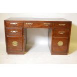 An oriental style elm seven drawer kneehole desk with brass plate handles and parquetry top, 55" x