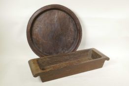 A carved wood platter, A/F, and a carved and hollowed wooden trough, 16" diameter