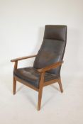 A Parker Knoll beechwood open armchair with leatherette covers